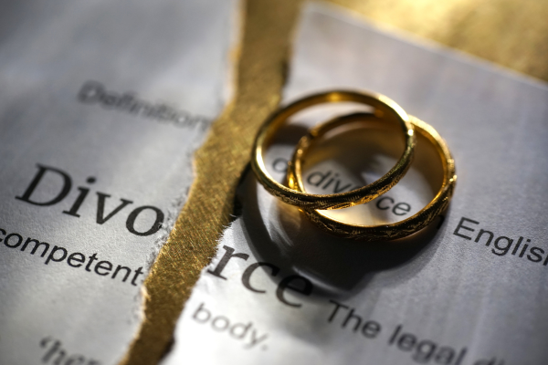 Divorce papers and wedding rings
